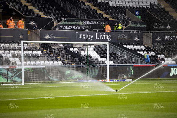 040223 - Swansea City v Birmingham City - Sky Bet Championship - Sprinklers water the pitch at the Swanseacom Stadium