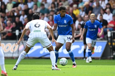 080826 - Swansea City v Birmingham City - Carabao Cup First Round - Jhon Solis of Birmingham City is challenged by Marko Stamenic of Swansea City