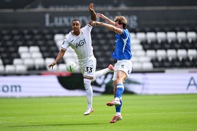 080826 - Swansea City v Birmingham City - Carabao Cup First Round - Adam Idah of Swansea City is challenged by Phil Neumann of Birmingham City