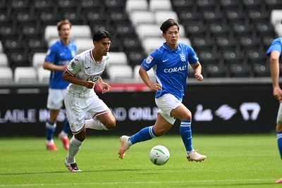 080826 - Swansea City v Birmingham City - Carabao Cup First Round - Marko Stamenic of Swansea City is challenged by Paik Seung-Ho of Birmingham City
