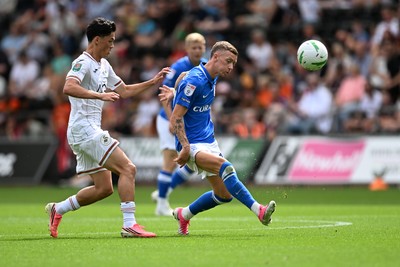 080826 - Swansea City v Birmingham City - Carabao Cup First Round - Elijah Just of Swansea City is challenged by Jay Stansfield of Birmingham City