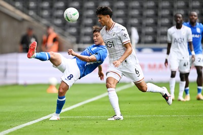 080826 - Swansea City v Birmingham City - Carabao Cup First Round - Paik Seung-Ho of Birmingham City is challenged by Marko Stamenic of Swansea City