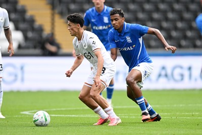 080826 - Swansea City v Birmingham City - Carabao Cup First Round - Elijah Just of Swansea City is challenged by Jhon Solis of Birmingham City