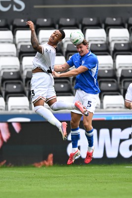 080826 - Swansea City v Birmingham City - Carabao Cup First Round - Adam Idah of Swansea City is challenged by Phil Neumann of Birmingham City