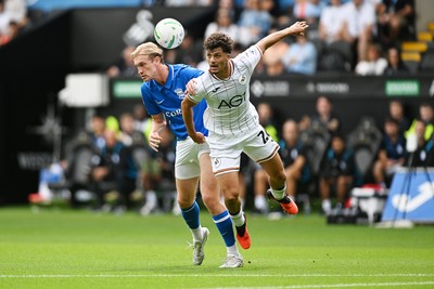 080826 - Swansea City v Birmingham City - Carabao Cup First Round - Christoph Klarer of Birmingham City is challenged by Filip Lissah of Swansea City