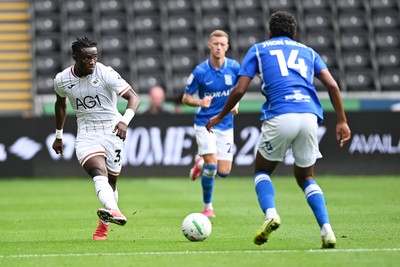 080826 - Swansea City v Birmingham City - Carabao Cup First Round - Jospeh Opoku of Swansea City is challenged by Jhon Solis of Birmingham City