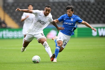 080826 - Swansea City v Birmingham City - Carabao Cup First Round - Adam Idah of Swansea City is challenged by Tomoki Iwata of Birmingham City