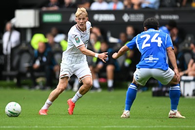 080826 - Swansea City v Birmingham City - Carabao Cup First Round - Melker Widell of Swansea City is challenged by Tomoki Iwata of Birmingham City