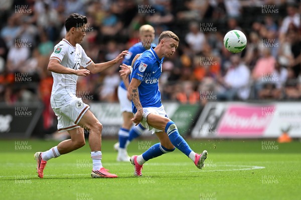 080826 - Swansea City v Birmingham City - Carabao Cup First Round - Elijah Just of Swansea City is challenged by Jay Stansfield of Birmingham City