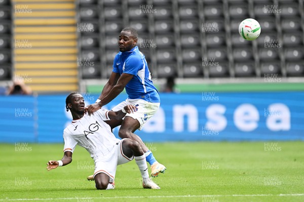 080826 - Swansea City v Birmingham City - Carabao Cup First Round - Moussa Yeo of Swansea City is challenged by Bright Osayi-Samuel of Birmingham City