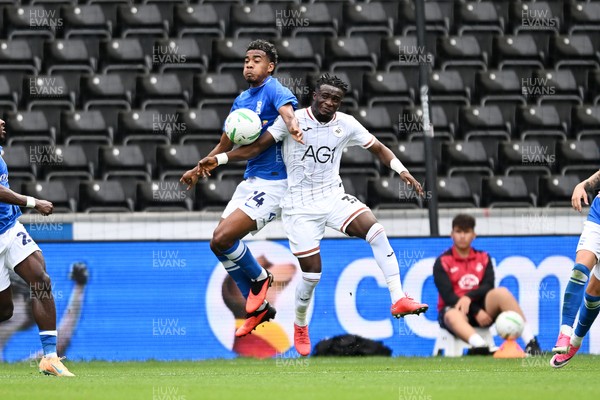 080826 - Swansea City v Birmingham City - Carabao Cup First Round - Jhon Solis of Birmingham City is challenged by Jospeh Opoku of Swansea City