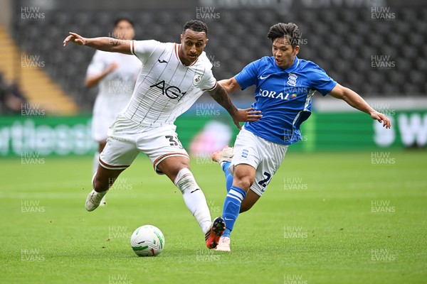 080826 - Swansea City v Birmingham City - Carabao Cup First Round - Adam Idah of Swansea City is challenged by Tomoki Iwata of Birmingham City