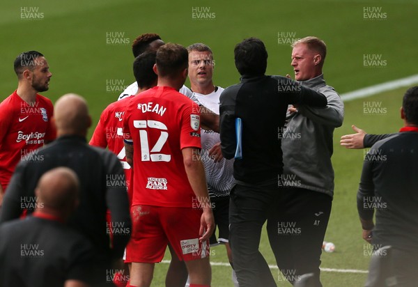 190920 - Swansea City v Birmingham City - SkyBet Championship - Swansea Assistant Manager Alan Tate being pushed away by Birmingham City Manager Aitor Karanka and players after his confrontation with Jon Toral of Birmingham at half time