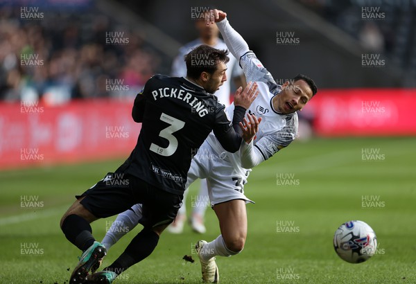 020324 - Swansea City v Blackburn Rovers - SkyBet Championship - Ronald of Swansea is tackled by Harry Pickering of Blackburn 