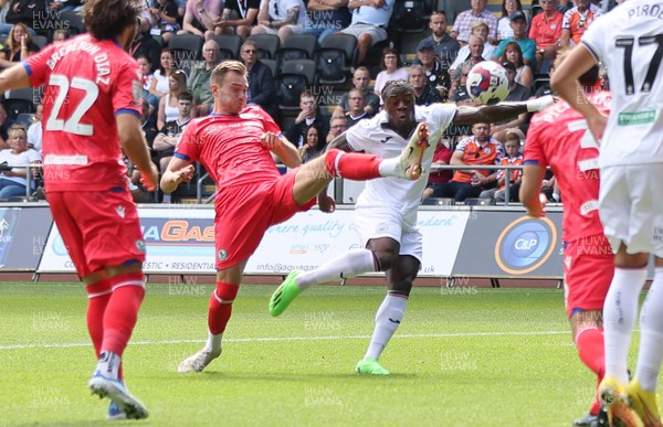 060822 - Swansea City v Blackburn Rovers, Sky Bet Championship - Michael Obafemi of Swansea City looks to get a shot at goal as Ryan Hedges of Blackburn Rovers challenges