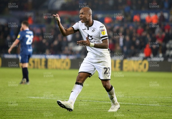 111219 - Swansea City v Blackburn Rovers - SkyBet Championship - Andre Ayew of Swansea City questions the linesman