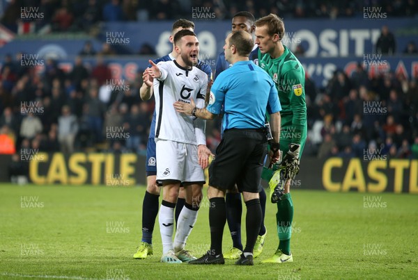 111219 - Swansea City v Blackburn Rovers - SkyBet Championship - Matt Grimes of Swansea City contests Jeremy Simpson the referee's decision