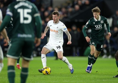 200126 - Swansea City v Blackburn Rovers - SkyBet Championship - Josh Tymon of Swansea City is challenged by Yuri Ribeiro of Blackburn Rovers 