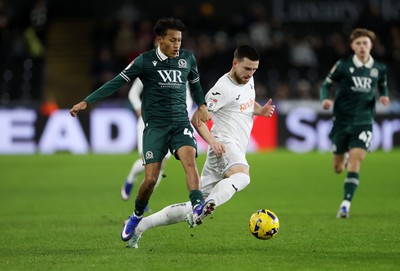 200126 - Swansea City v Blackburn Rovers - SkyBet Championship - Zan Vipotnik of Swansea City is tackled by Brandon Powell of Blackburn Rovers 