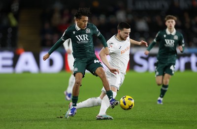 200126 - Swansea City v Blackburn Rovers - SkyBet Championship - Zan Vipotnik of Swansea City is tackled by Brandon Powell of Blackburn Rovers 