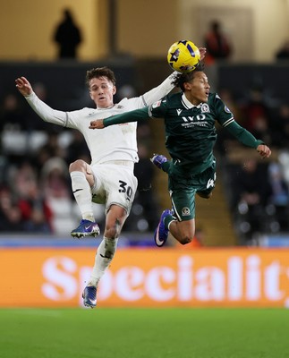 200126 - Swansea City v Blackburn Rovers - SkyBet Championship - Ethan Galbraith of Swansea City and Brandon Powell of Blackburn Rovers go for the high ball