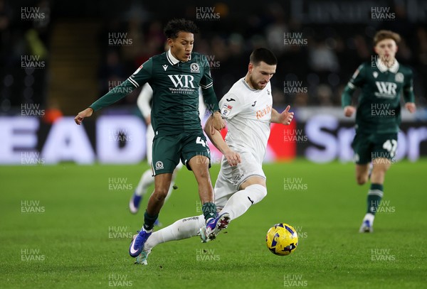 200126 - Swansea City v Blackburn Rovers - SkyBet Championship - Zan Vipotnik of Swansea City is tackled by Brandon Powell of Blackburn Rovers 