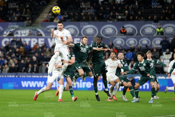 200126 - Swansea City v Blackburn Rovers - SkyBet Championship - Zan Vipotnik of Swansea City headers the ball to score a goal