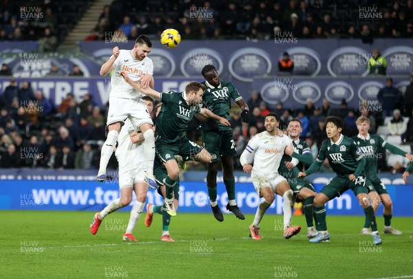 200126 - Swansea City v Blackburn Rovers - SkyBet Championship - Zan Vipotnik of Swansea City headers the ball to score a goal