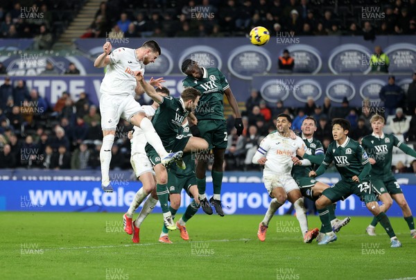 200126 - Swansea City v Blackburn Rovers - SkyBet Championship - Zan Vipotnik of Swansea City headers the ball to score a goal