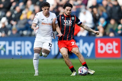 220225 - Swansea City v Blackburn Rovers - Sky Bet Championship - Goncalo Franco of Swansea City battles for the ball with Zak Gilsenan of Blackburn Rovers