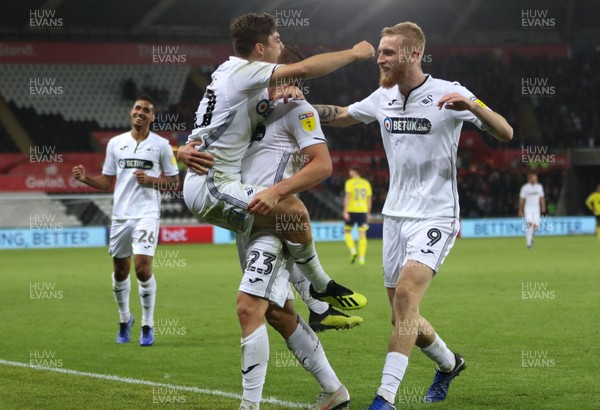 231018 - Swansea City v Blackburn Rovers, Sky Bet Championship - Swansea City players celebrate after Connor Roberts of Swansea City scores the second goal