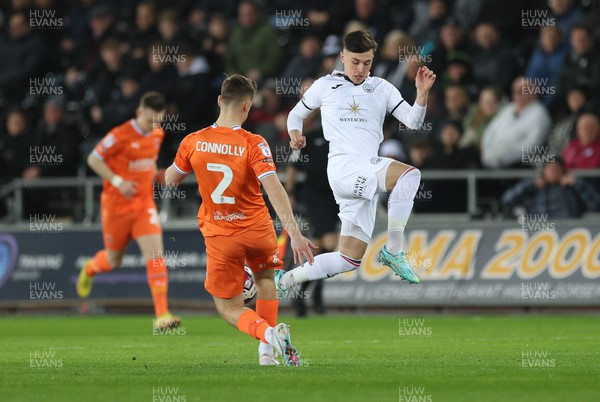 150223 - Swansea City v Blackpool, EFL Sky Bet Championship - Luke Cundle of Swansea City closes in on Callum Connolly of Blackpool