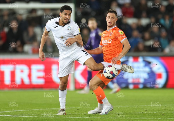 150223 - Swansea City v Blackpool, EFL Sky Bet Championship - Ben Cabango of Swansea City and Jerry Yates of Blackpool compete for the ball
