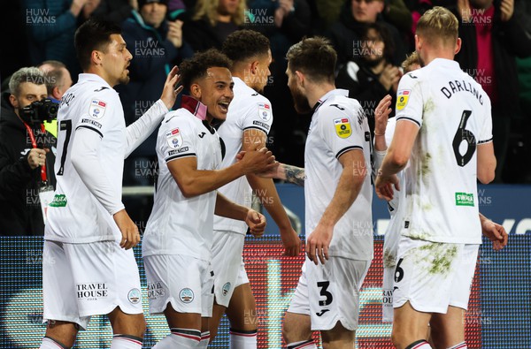 150223 - Swansea City v Blackpool, EFL Sky Bet Championship - Matty Sorinola of Swansea City celebrates with team mates after he scores the opening goal