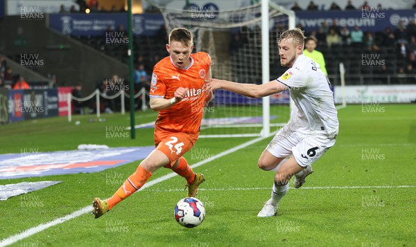 150223 - Swansea City v Blackpool, EFL Sky Bet Championship - Andy Lyons of Blackpool and Harry Darling of Swansea City compete for the ball
