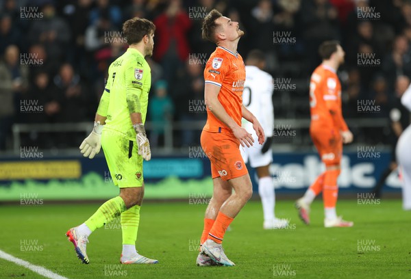 150223 - Swansea City v Blackpool, EFL Sky Bet Championship - Callum Connolly of Blackpool reacts after he puts the ball in his own net to give Swansea their second goal