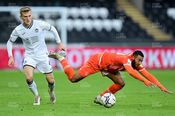 201121 - Swansea City v Blackpool - Sky Bet Championship - Keshi Anderson of Blackpool is fouled by Flynn Downes of Swansea City 