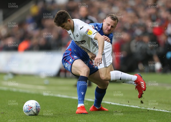 020319 - Swansea City v Bolton Wanderers, Sky Bet Championship - Daniel James of Swansea City is brought down by David Wheater of Bolton Wanderers