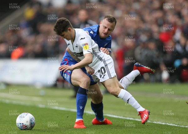 020319 - Swansea City v Bolton Wanderers, Sky Bet Championship - Daniel James of Swansea City is brought down by David Wheater of Bolton Wanderers