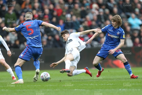 020319 - Swansea City v Bolton Wanderers, Sky Bet Championship - Daniel James of Swansea City is brought down by Luca Connell of Bolton Wanderers