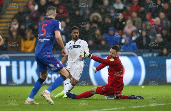 020319 - Swansea City v Bolton Wanderers, Sky Bet Championship - Wayne Routledge of Swansea City is denied a goal as Bolton Wanderers goalkeeper Remi Matthews saves