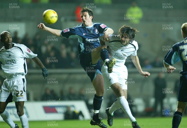 030206 Swansea City v Bournemouth Swansea's Rory Fallon beats Marcus Browning to head the ball at goal  