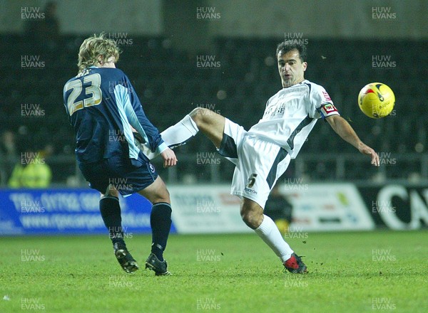 030206 Swansea City v Bournemouth Swansea's Roberto Martinez catches Ben Rix as he challenges for the ball   