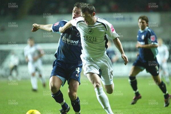 030206 Swansea City v Bournemouth Swansea's Kevin McLeod breaks away from Marcus Browning  