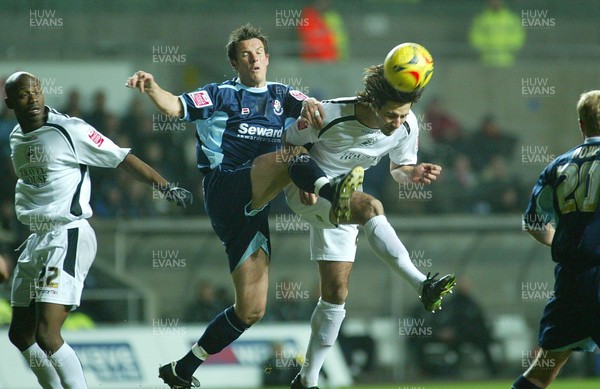 030206 Swansea City v Bournemouth Swansea's Rory Fallon beats Marcus Browning to head the ball at goal  