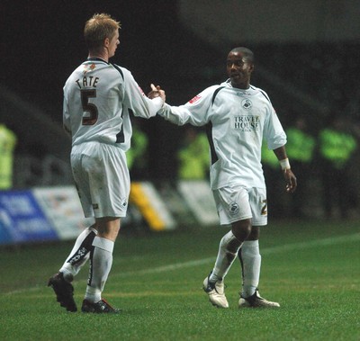 140206 - Swansea City v Bradford City - Swansea's Leon Knight is congratulated by Alan Tate after scoring 