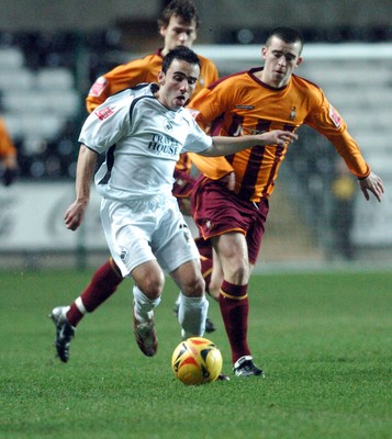 140206 - Swansea City v Bradford City - Swansea's Leon Britton tries to break through bradford's defence  