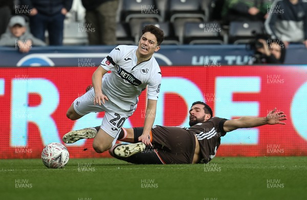 170219 - Swansea City v Brentford, FA Cup Fifth Round - Daniel James of Swansea City is brought down by Yoann Barbet of Brentford