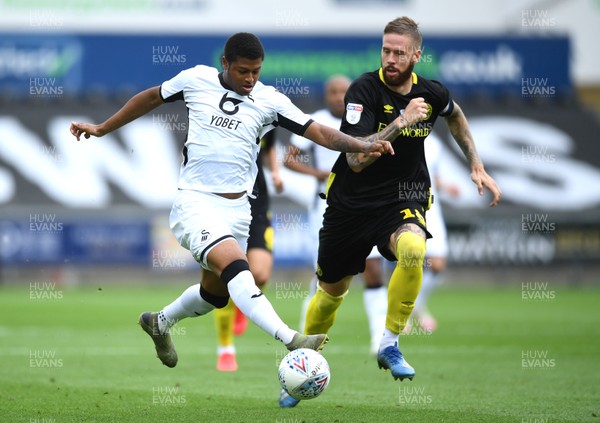 260720 - Swansea City v Brentford - EFL SkyBet Championship Play-Off - Rhian Brewster of Swansea City is tackled by Pontus Jansson of Brentford
