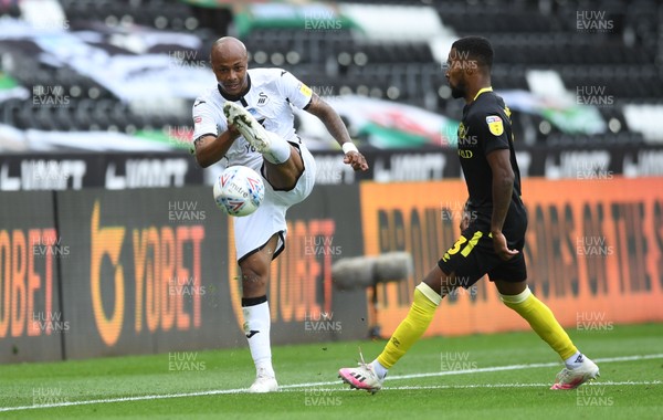 260720 - Swansea City v Brentford - EFL SkyBet Championship Play-Off - Andre Ayew of Swansea City is challenged by Rico Henry of Brentford